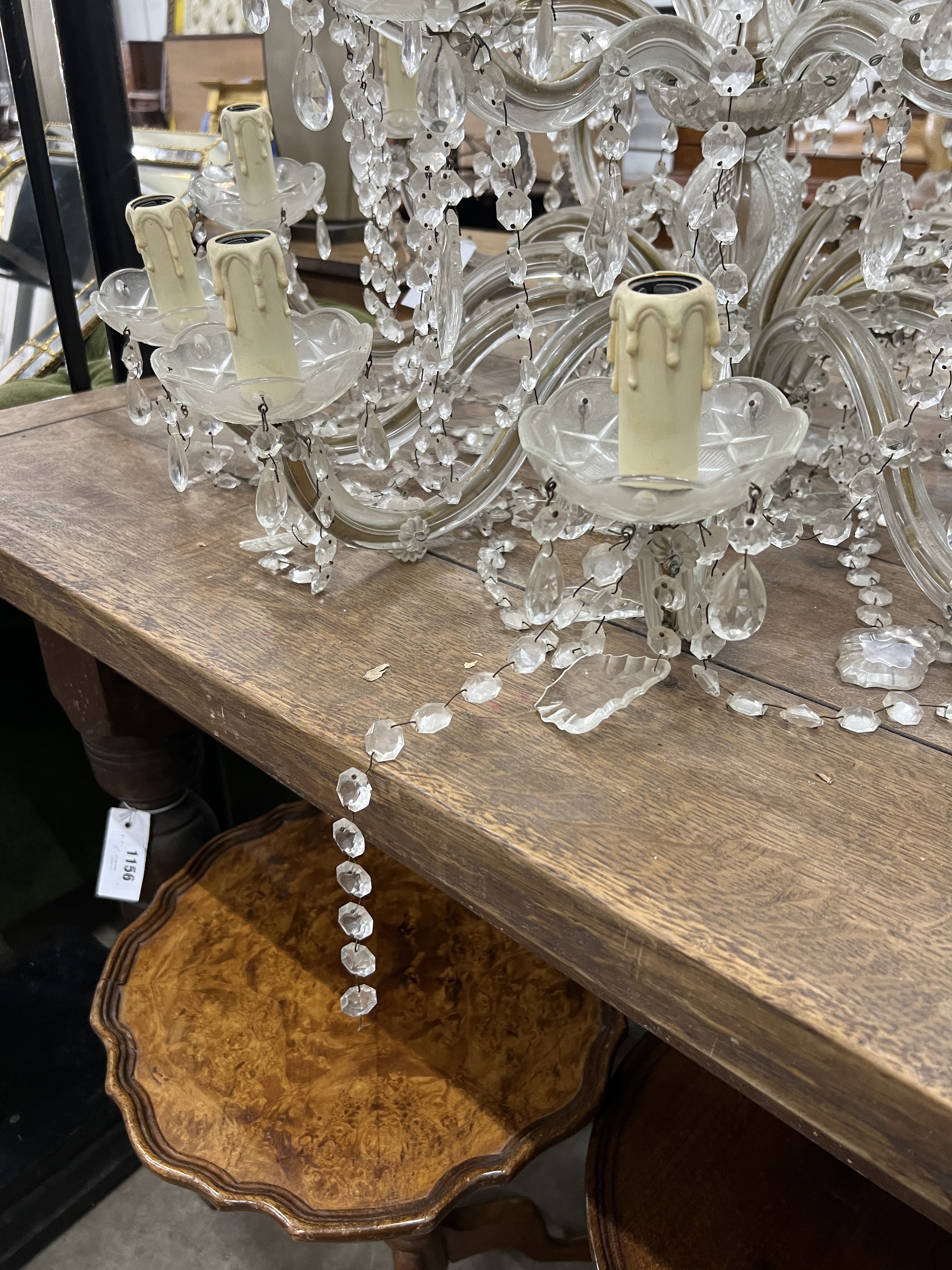 A moulded glass eighteen branch electrolier, hung circular and pear shaped faceted drops, height 56cm